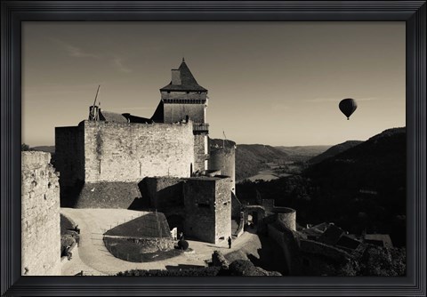 Framed Chateau de Castelnaud with hot air balloon flying over a valley, Castelnaud-la-Chapelle, Dordogne, Aquitaine, France Print