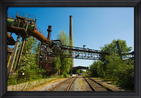 Framed Railroad tracks passing through an old steel mill, North Duisburg Landscape Park, Ruhr, North Rhine Westphalia, Germany Print