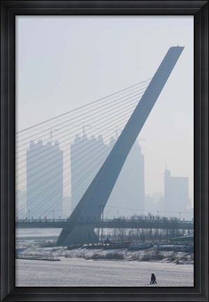 Framed Songhuajiang Highway Bridge across the frozen Songhua River with buildings in the background, Harbin, China Print
