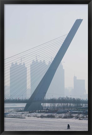 Framed Songhuajiang Highway Bridge across the frozen Songhua River with buildings in the background, Harbin, China Print