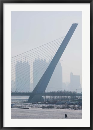 Framed Songhuajiang Highway Bridge across the frozen Songhua River with buildings in the background, Harbin, China Print