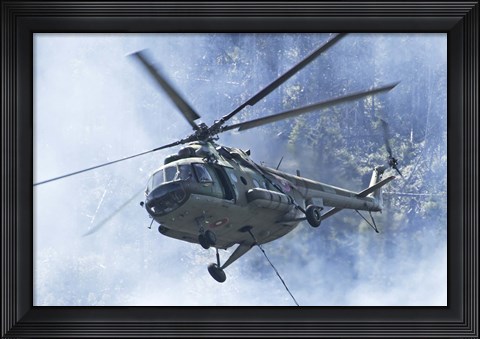 Framed Bulgarian Air Force Mi-17 helicopter over a forest fire in Bulgaria Print
