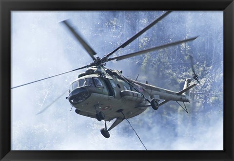 Framed Bulgarian Air Force Mi-17 helicopter over a forest fire in Bulgaria Print