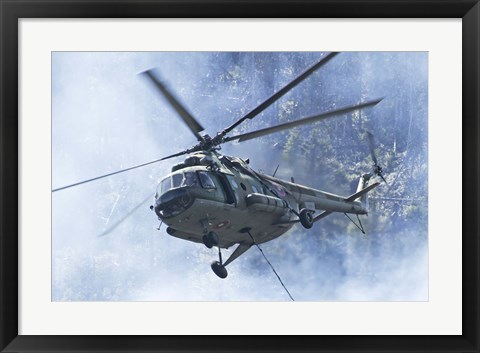 Framed Bulgarian Air Force Mi-17 helicopter over a forest fire in Bulgaria Print