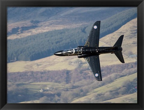 Framed Hawk T1 trainer aircraft of the Royal Air Force low flying over North Wales Print