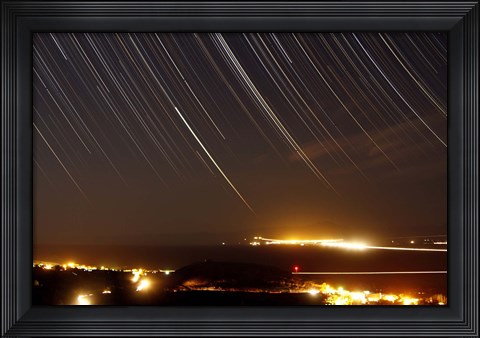 Framed Star trails above a village in the central desert of Iran Print