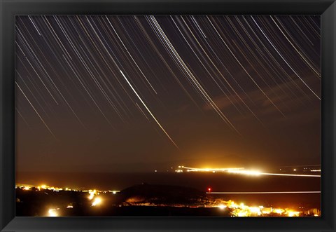 Framed Star trails above a village in the central desert of Iran Print