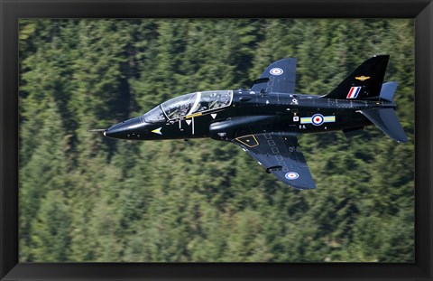 Framed Hawk T1 trainer aircraft of the Royal Air Force flying over a forest in North Wales Print