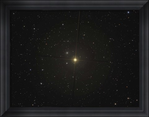 Framed red giant star Beta Andromedae and its ghost galaxy NGC 404 Print