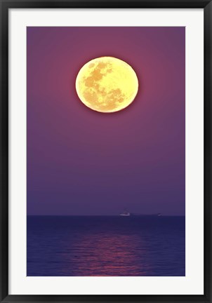 Framed Thunder&#39;s Moon and its reflection above the water Print