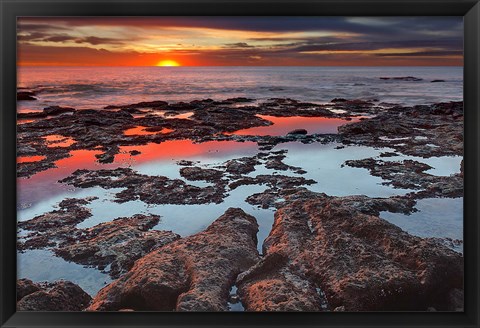 Framed Tidal pools reflect the sunrise colors during the autumn equinox Print