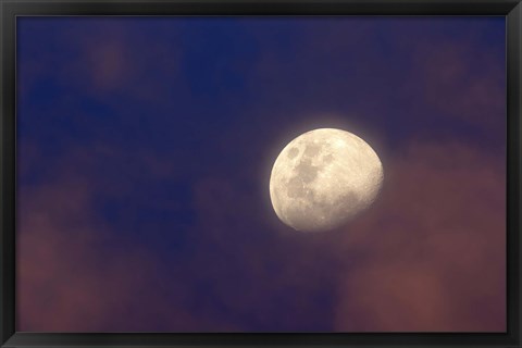 Framed moon between colorful clouds at sunset Print