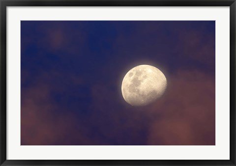 Framed moon between colorful clouds at sunset Print