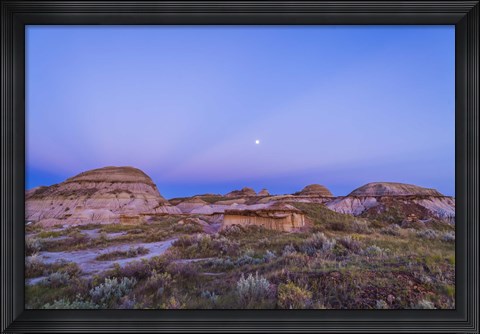 Framed Gibbous moon and crepuscular rays over Dinosaur Provincial Park, Canada Print