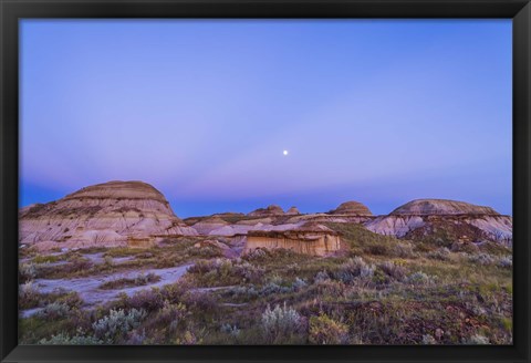 Framed Gibbous moon and crepuscular rays over Dinosaur Provincial Park, Canada Print