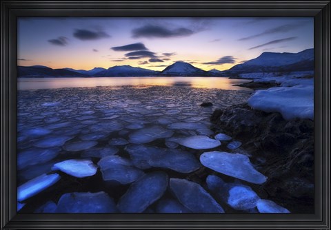 Framed Ice flakes drifting against the sunset in Tjeldsundet strait, Troms County, Norway Print