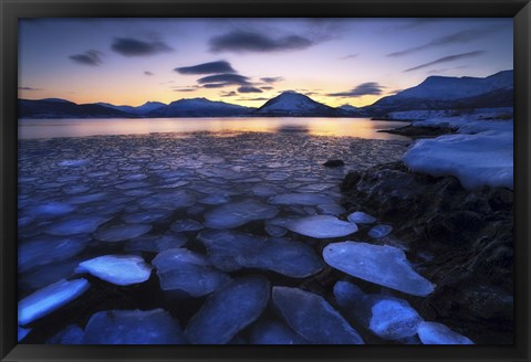 Framed Ice flakes drifting against the sunset in Tjeldsundet strait, Troms County, Norway Print