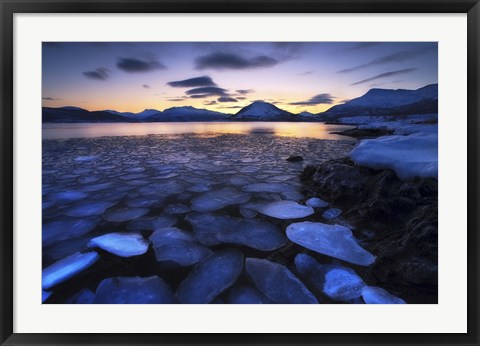 Framed Ice flakes drifting against the sunset in Tjeldsundet strait, Troms County, Norway Print