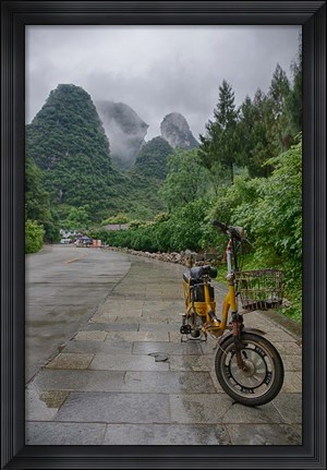 Framed Bicycle sits in front of the Guilin Mountains, Guilin, Yangshuo, China Print