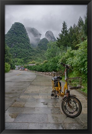 Framed Bicycle sits in front of the Guilin Mountains, Guilin, Yangshuo, China Print