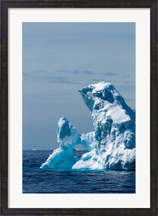 Framed arched iceberg floating in Gerlache Strait, Antarctica. Print