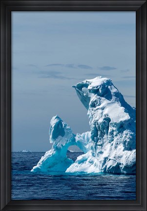 Framed arched iceberg floating in Gerlache Strait, Antarctica. Print
