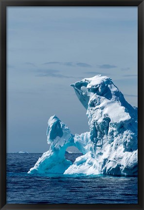 Framed arched iceberg floating in Gerlache Strait, Antarctica. Print