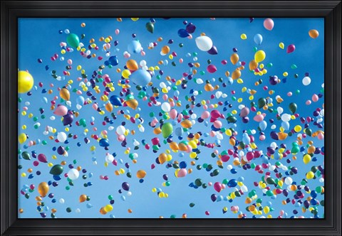 Framed Holiday balloons drifting into the sky Print
