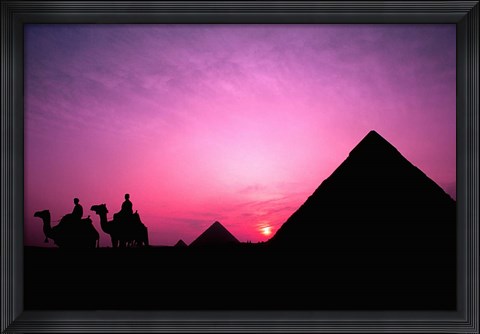 Framed Colorful Sunset Silhouetting Men and Camels at the Great Pyramids of Giza, Egypt Print