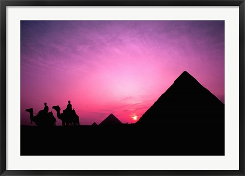 Framed Colorful Sunset Silhouetting Men and Camels at the Great Pyramids of Giza, Egypt Print