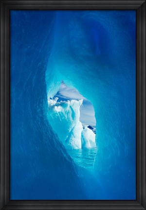 Framed Antarctica, Iceberg framed in arch of another in Wilhelmina Bay. Print