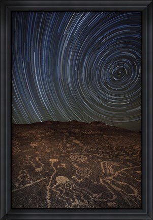 Framed Star trails at an ancient petroglyph site near Bishop, California Print