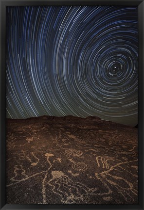 Framed Star trails at an ancient petroglyph site near Bishop, California Print