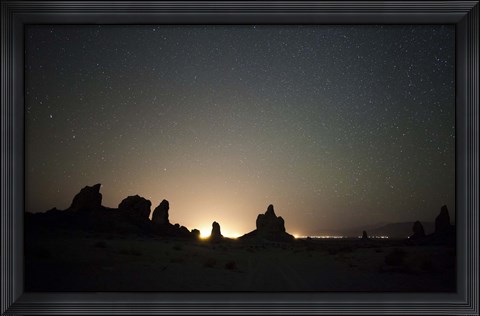 Framed Large tufa formations at Trona Pinnacles against a backdrop of stars Print