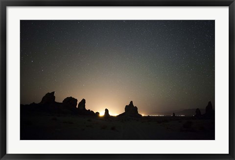 Framed Large tufa formations at Trona Pinnacles against a backdrop of stars Print