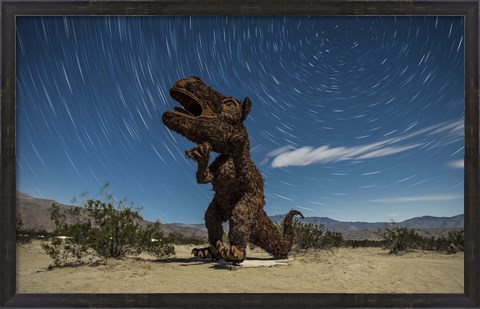 Framed Tyrannosaurus rex sculpture against a backdrop of star trails, California Print