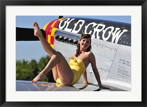 Framed Cute pin-up girl sitting on the wing of a P-51 Mustang Print