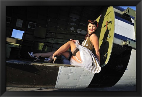 Framed Sexy 1940&#39;s style pin-up girl sitting inside of a C-47 Skytrain aircraft Print