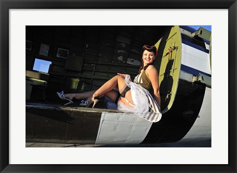 Framed Sexy 1940&#39;s style pin-up girl sitting inside of a C-47 Skytrain aircraft Print