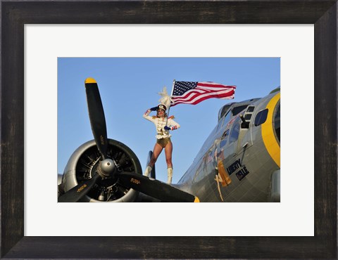 Framed 1940&#39;s style majorette pin-up girl on a B-17 bomber with an American flag Print