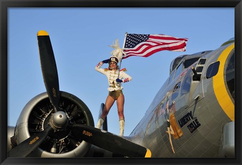 Framed 1940&#39;s style majorette pin-up girl on a B-17 bomber with an American flag Print