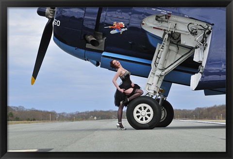 Framed 1940&#39;s style pin-up girl resting on the wheel of a TBM Avenger Print