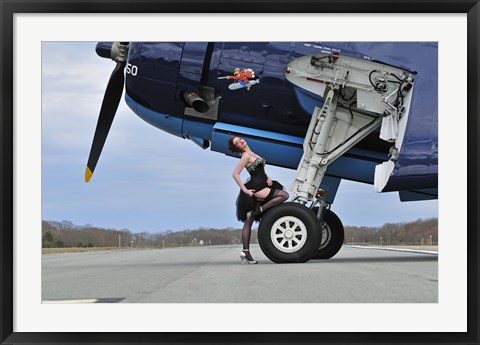 Framed 1940&#39;s style pin-up girl resting on the wheel of a TBM Avenger Print