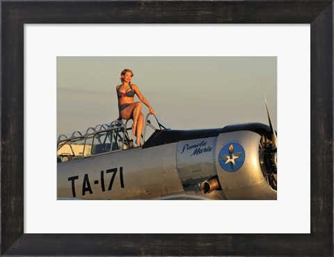 Framed 1940&#39;s style pin-up girl sitting on the cockpit of a World War II T-6 Texan Print