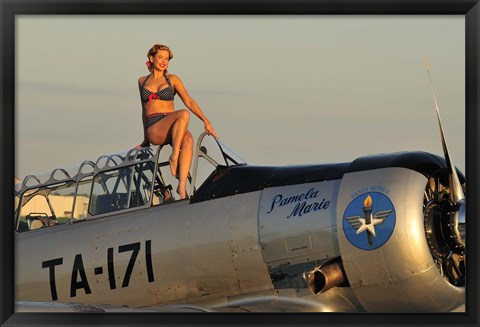 Framed 1940&#39;s style pin-up girl sitting on the cockpit of a World War II T-6 Texan Print