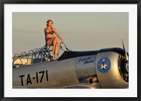 Framed 1940&#39;s style pin-up girl sitting on the cockpit of a World War II T-6 Texan Print