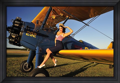 Framed 1940&#39;s style pin-up girl sitting on the wing of a Stearman biplane Print