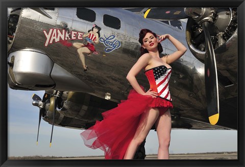 Framed Beautiful 1940&#39;s style pin-up girl standing under a B-17 bomber Print