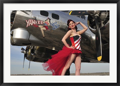 Framed Beautiful 1940&#39;s style pin-up girl standing under a B-17 bomber Print