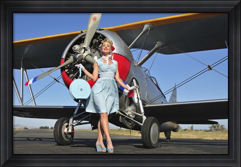 Framed Elegant 1940&#39;s style pin-up girl standing in front of an F3F biplane Print